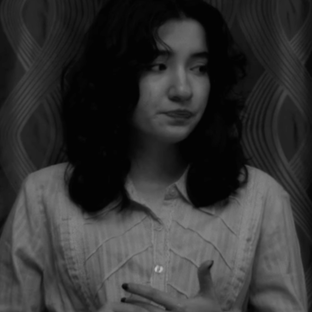 A black and white photo of a woman looking to the right